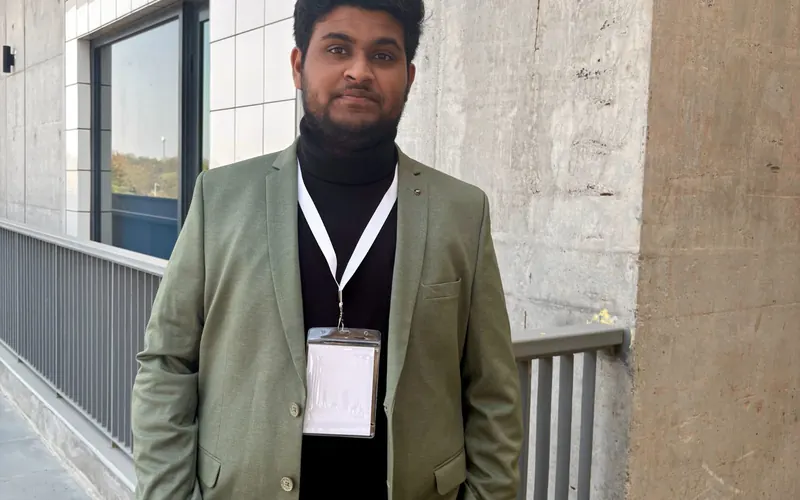 Vahini team member wearing a conference badge at an IIT campus event